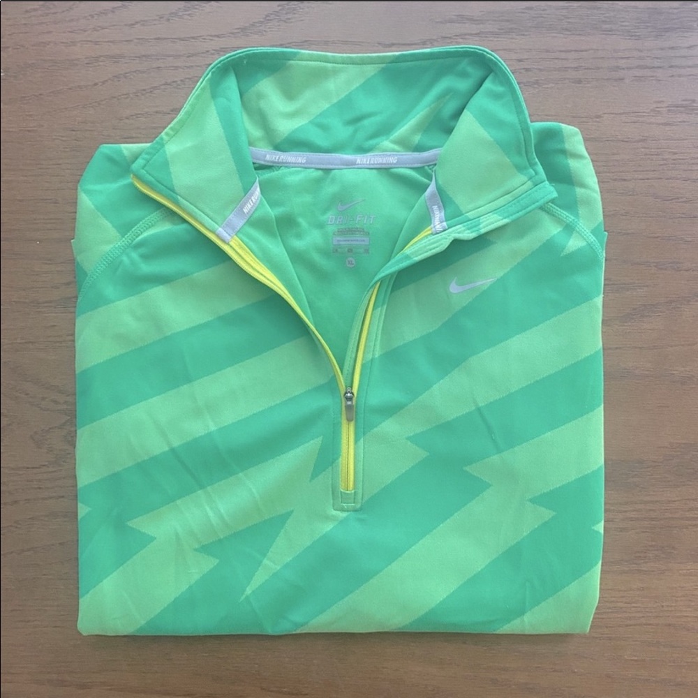 Nike- Dri-Fit 1/2 zip pullover “lightning” pattern